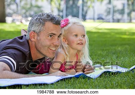 father and young daughter spending quality time together in a park; edmonton alberta canada View Large Photo Image Stock Photo - father and young daughter spending quality time together in a park; edmonton alberta canada. Fotosearch
