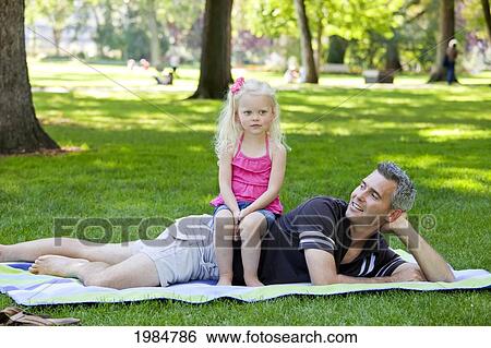 father and young daughter spending quality time together in a park; edmonton alberta canada View Large Photo Image Stock Photograph - father and young daughter spending quality time together in a park; edmonton alberta canada. Fotosearch