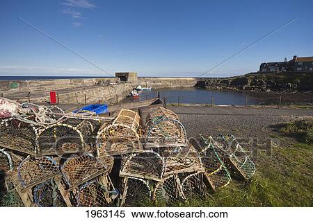 Stock Photography - fishing traps and nets on the shore; craster, northumberland, england. Fotosearch