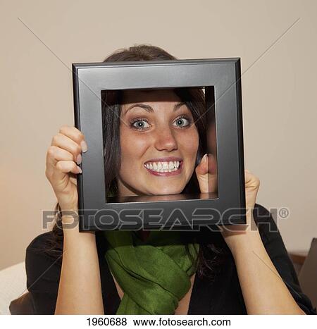 girl peering through frame; edmonton, alberta, canada View Large Photo Image Stock Photo - girl peering through frame; edmonton, alberta, canada. Fotosearch
