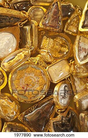 gold buddhist amulets; prachuap kiri khan prachuap province thailand View Large Photo Image Stock Image - gold buddhist amulets; prachuap kiri khan prachuap province thailand. Fotosearch