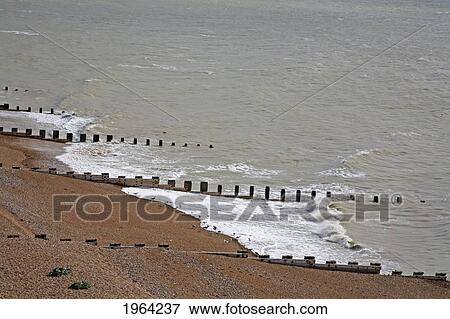groynes along the coastline; hastings, sussex, england View Large Photo Image Stock Photo - groynes along the coastline; hastings, sussex, england. Fotosearch