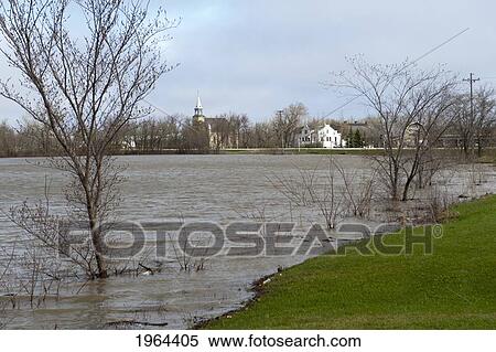 Stock Photography - high water levels in assiniboine river after flooding; st. francois xavier, manitoba, canada. Fotosearch