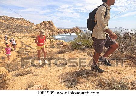 Stock Photo - hikers along a scenic desert trail; baja california sur mexico. Fotosearch
