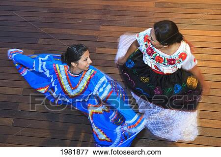 hispanic women dancing in traditional folkloric dresses guaycura boutique hotel and spa; todos santos baja california mexico View Large Photo Image Stock Photo - hispanic women dancing in traditional folkloric dresses guaycura boutique hotel and spa; todos santos baja california mexico. Fotosearch