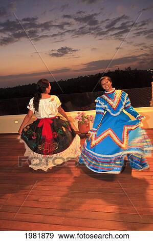 hispanic women dancing in traditional folkloric dresses guaycura boutique hotel and spa; todos santos baja california mexico View Large Photo Image Stock Photo - hispanic women dancing in traditional folkloric dresses guaycura boutique hotel and spa; todos santos baja california mexico. Fotosearch