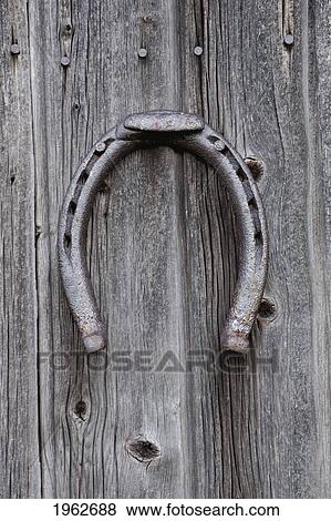 horseshoe hanging on a wooden wall; iron hill, quebec, canada View Large Photo Image Stock Photo - horseshoe hanging on a wooden wall; iron hill, quebec, canada. Fotosearch