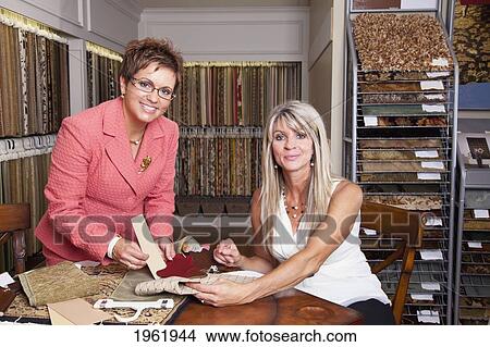 interior designer consulting with client on remodelling of home at a showroom; edmonton, alberta, canada View Large Photo Image Picture - interior designer consulting with client on remodelling of home at a showroom; edmonton, alberta, canada. Fotosearch
