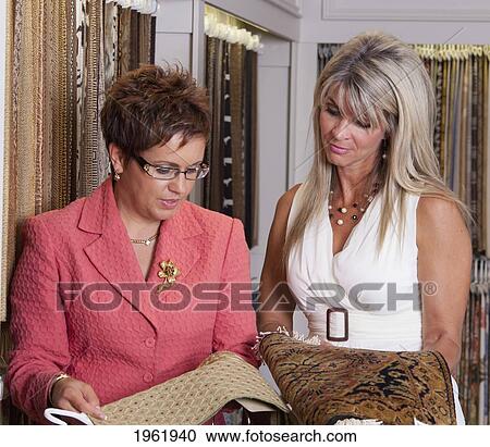 interior designer consulting with client on remodelling of home at a showroom; edmonton, alberta, canada View Large Photo Image Stock Image - interior designer consulting with client on remodelling of home at a showroom; edmonton, alberta, canada. Fotosearch