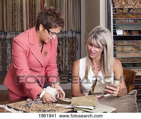 interior designer consulting with client on remodelling of home at a showroom; edmonton, alberta, canada View Large Photo Image Stock Image - interior designer consulting with client on remodelling of home at a showroom; edmonton, alberta, canada. Fotosearch