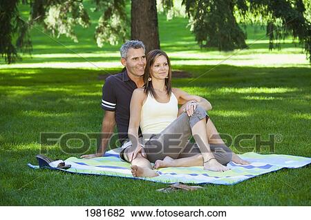 Stock Image - married couple together in a park; edmonton alberta canada. Fotosearch