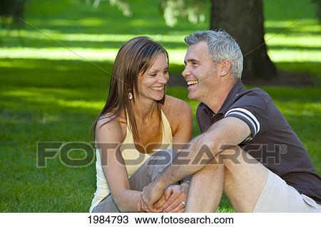married couple together in a park; edmonton alberta canada View Large Photo Image Stock Image - married couple together in a park; edmonton alberta canada. Fotosearch