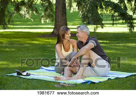 married couple together in a park; edmonton alberta canada View Large Photo Image Stock Photo - married couple together in a park; edmonton alberta canada. Fotosearch