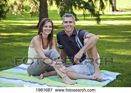 married couple together in a park; edmonton alberta canada View Large Photo Image Stock Photo - married couple together in a park; edmonton alberta canada. Fotosearch