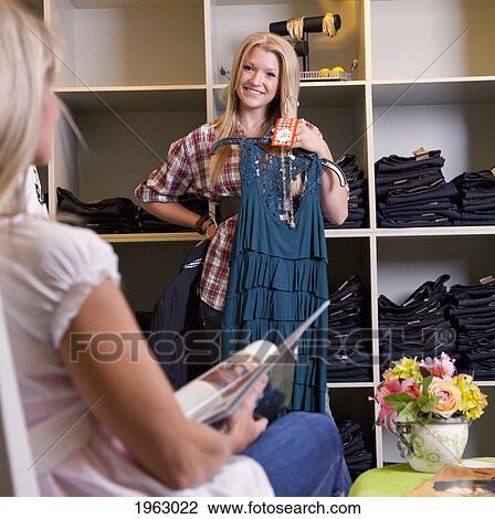 mother and daughter shopping for clothes at a boutique; edmonton, alberta, canada View Large Photo Image Stock Image - mother and daughter shopping for clothes at a boutique; edmonton, alberta, canada. Fotosearch