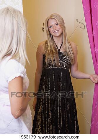 mother and daughter shopping for clothing at a boutique; edmonton, alberta, canada View Large Photo Image Stock Photo - mother and daughter shopping for clothing at a boutique; edmonton, alberta, canada. Fotosearch