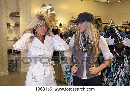 mother and daughter shopping for clothing at a boutique; edmonton, alberta, canada View Large Photo Image Stock Photograph - mother and daughter shopping for clothing at a boutique; edmonton, alberta, canada. Fotosearch