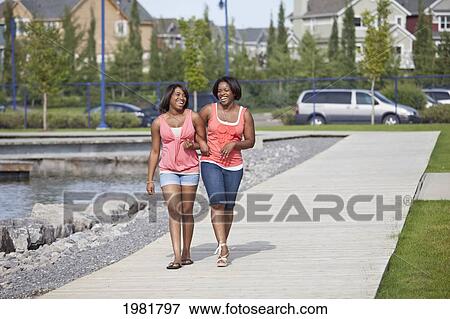 mother and daughter spending quality time together outdoors; edmonton alberta canada View Large Photo Image Stock Photo - mother and daughter spending quality time together outdoors; edmonton alberta canada. Fotosearch