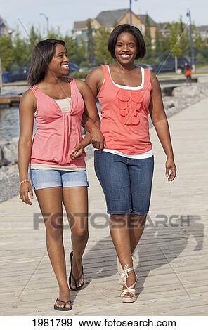 Stock Photo - mother and daughter spending quality time together outdoors; edmonton alberta canada. Fotosearch