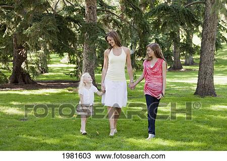mother and daughters walking in the park; edmonton alberta canada View Large Photo Image Stock Image - mother and daughters walking in the park; edmonton alberta canada. Fotosearch