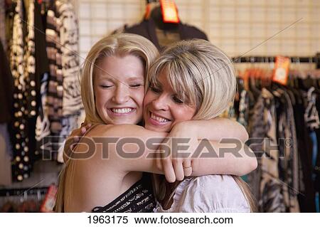 mother buying daughter a dress at a boutique; edmonton, alberta, canada View Large Photo Image Stock Photography - mother buying daughter a dress at a boutique; edmonton, alberta, canada. Fotosearch