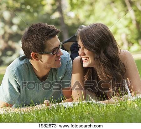 Stock Image - newlywed couple spending quality time together in a park; edmonton alberta canada. Fotosearch
