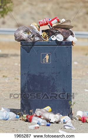 overflowing rubbish bin at a highway rest stop; malaga province spain View Large Photo Image Stock Photo - overflowing rubbish bin at a highway rest stop; malaga province spain. Fotosearch
