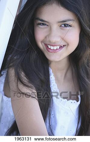 portrait of a girl with long, dark hair; troutdale, oregon, united states of america View Large Photo Image Stock Image - portrait of a girl with long, dark hair; troutdale, oregon, united states of america. Fotosearch
