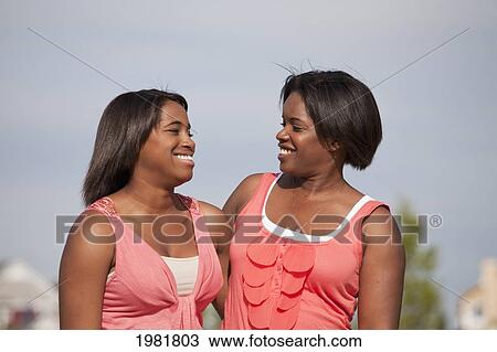 portrait of a mother and daughter outdoors; edmonton alberta canda View Large Photo Image Stock Image - portrait of a mother and daughter outdoors; edmonton alberta canda. Fotosearch