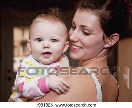 portrait of a mother and infant girl smiling; spruce grove alberta canada View Large Photo Image Stock Photography - portrait of a mother and infant girl smiling; spruce grove alberta canada. Fotosearch