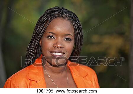 Stock Photography - portrait of a woman in a park; edmonton alberta canada. Fotosearch