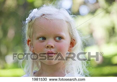 portrait of a young girl in a park; edmonton alberta canada View Large Photo Image Stock Image - portrait of a young girl in a park; edmonton alberta canada. Fotosearch