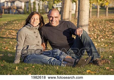 portrait of husband and wife in a park; beaumont alberta canada View Large Photo Image Stock Photo - portrait of husband and wife in a park; beaumont alberta canada. Fotosearch