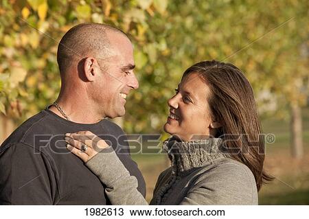 portrait of husband and wife together in a park; beaumont alberta canada View Large Photo Image Stock Image - portrait of husband and wife together in a park; beaumont alberta canada. Fotosearch