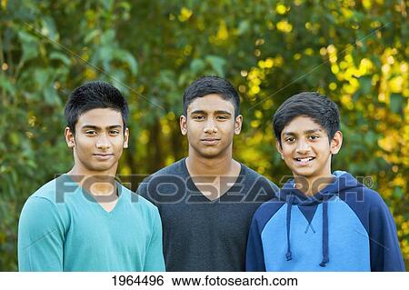 portrait of three teenage brothers in a park setting; edmonton alberta canada View Large Photo Image Stock Photograph - portrait of three teenage brothers in a park setting; edmonton alberta canada. Fotosearch