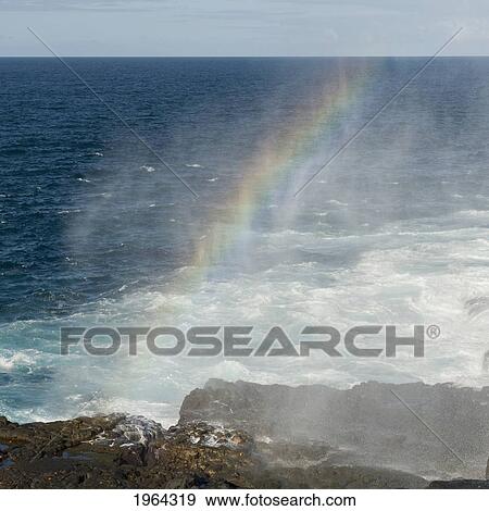 rainbow at a blow hole on the coast; galapagos, equador View Large Photo Image Stock Photo - rainbow at a blow hole on the coast; galapagos, equador. Fotosearch