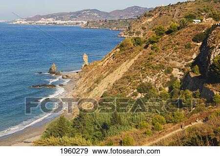 Stock Photo - rio de la miel, las alberquillas beach and the cliffs of maro-cerro gordo natural park, near maro and nerja; malaga province, costa del sol, andalusia, spain. Fotosearch