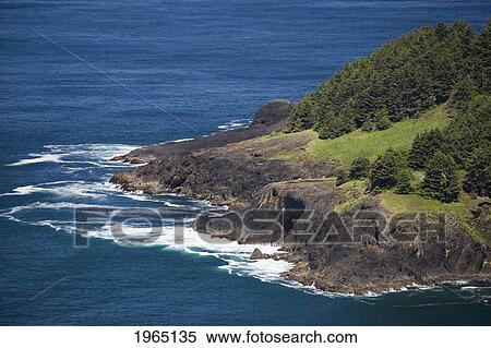 rocky coastline with trees on a hillside; otter rock oregon united states of america View Large Photo Image Stock Photography - rocky coastline with trees on a hillside; otter rock oregon united states of america. Fotosearch