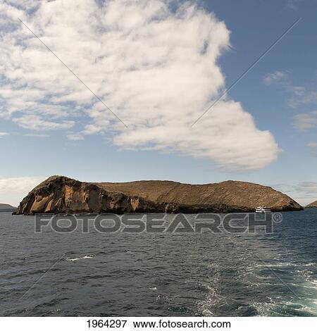 santiago island and a boat in the ocean; galapagos, equador View Large Photo Image Stock Photo - santiago island and a boat in the ocean; galapagos, equador. Fotosearch