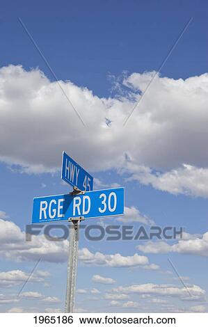 Stock Photograph - signs of two intersecting roads; alberta canada. Fotosearch