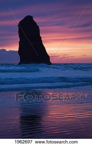 silhouette of a rock formation at sunset; cannon beach, oregon, united states of america View Large Photo Image Stock Photo - silhouette of a rock formation at sunset; cannon beach, oregon, united states of america. Fotosearch