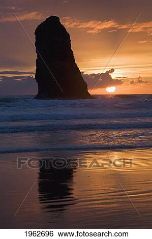 silhouette of a rock formation at sunset; cannon beach, oregon, united states of america View Large Photo Image Stock Photograph - silhouette of a rock formation at sunset; cannon beach, oregon, united states of america. Fotosearch