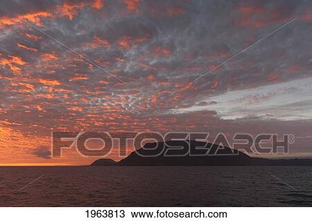 silhouette of hills along the coastline at sunset; galapagos, equador View Large Photo Image Stock Image - silhouette of hills along the coastline at sunset; galapagos, equador. Fotosearch