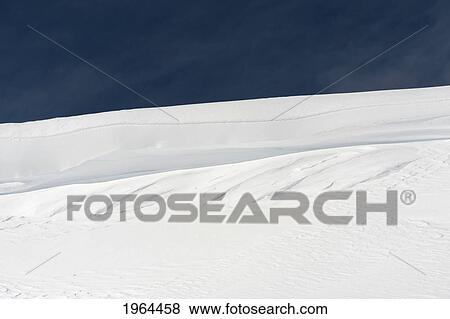 snow drifts on a hill against a blue sky; whistler, british columbia, canada View Large Photo Image Stock Photo - snow drifts on a hill against a blue sky; whistler, british columbia, canada. Fotosearch