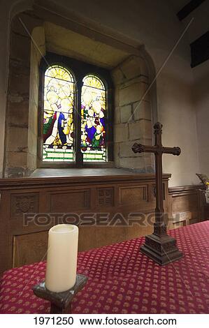 stained glass window and a table with a cross inside a church; northumberland england View Large Photo Image Stock Image - stained glass window and a table with a cross inside a church; northumberland england. Fotosearch