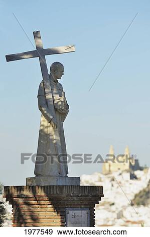 statue of a priest holding a cross; olvera cadiz andalusia spain View Large Photo Image Stock Photo - statue of a priest holding a cross; olvera cadiz andalusia spain. Fotosearch