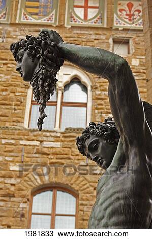 Stock Image - statue of perseus holding the head of medusa beside the palazzo vecchio; florence tuscany italy. Fotosearch