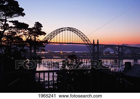 Stock Image - sunrise over newport bridge; newport oregon united states of america. Fotosearch