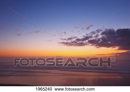 sunset over the ocean; newport oregon united states of america View Large Photo Image Stock Image - sunset over the ocean; newport oregon united states of america. Fotosearch