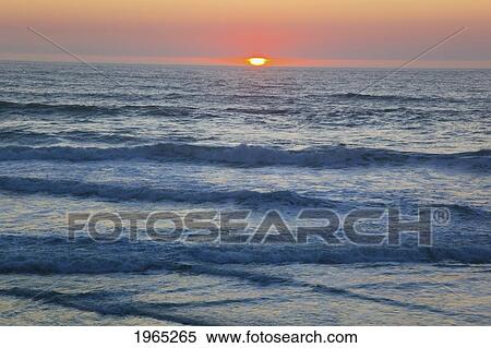 Stock Photography - sunset over the pacific ocean along the oregon coast; gleneden oregon united states of america. Fotosearch